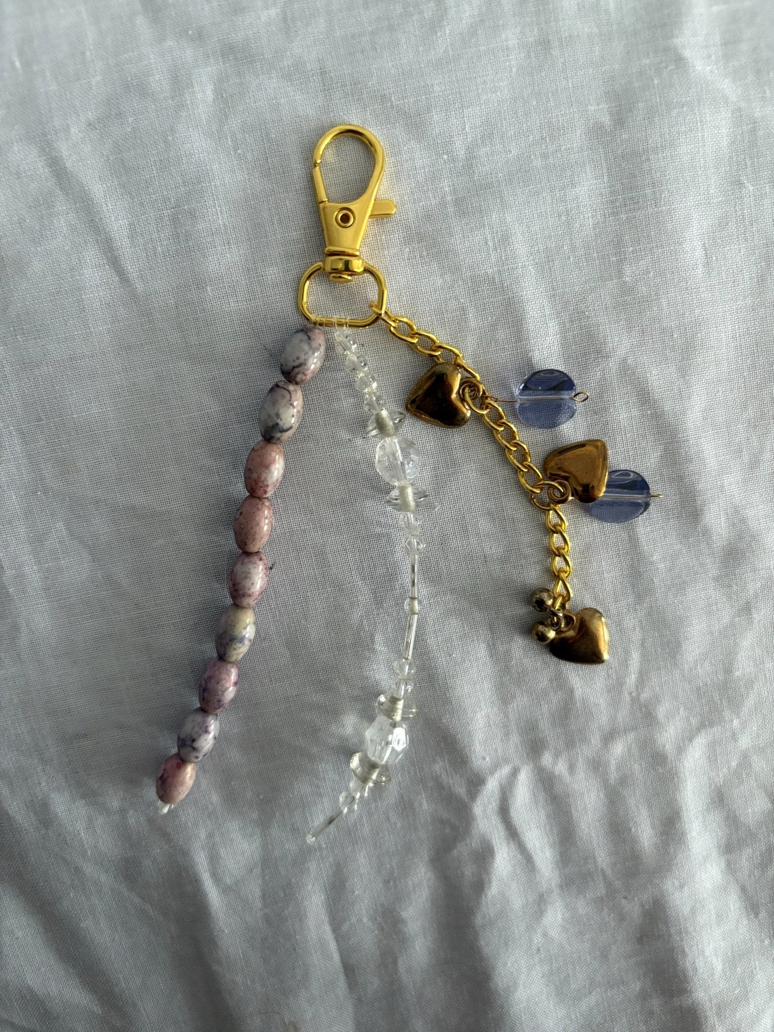 63fe71384f2da238419a4f9e_048064-purple-marble-bag-charm-1_1762747154693.jpg