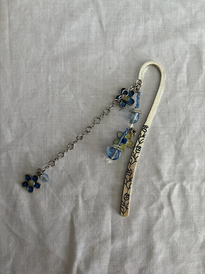 63fe71384f2da238419a4f9e_048065-blue-flower-bookmark-2_1762823619485.jpg