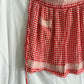 63fe71384f2da238419a4f9e_048072-red-gingham-apron-1_1762824133825.jpg