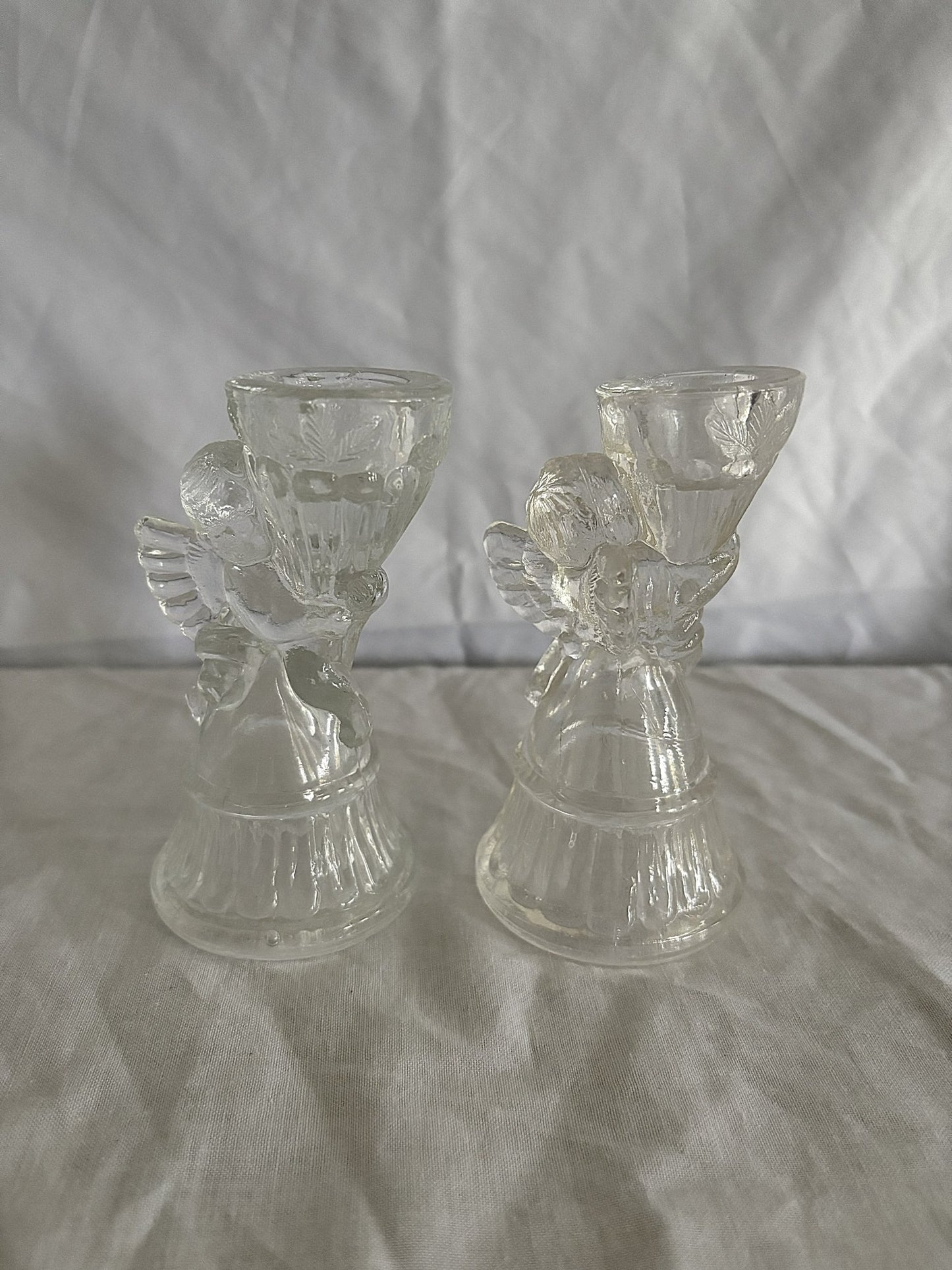 63fe71384f2da238419a4f9e_048083-glass-cherub-candle-holders-1_1763848170394.jpg