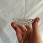 63fe71384f2da238419a4f9e_048085-crystal-clamshell-ring-holder-3_1763848567771.jpg