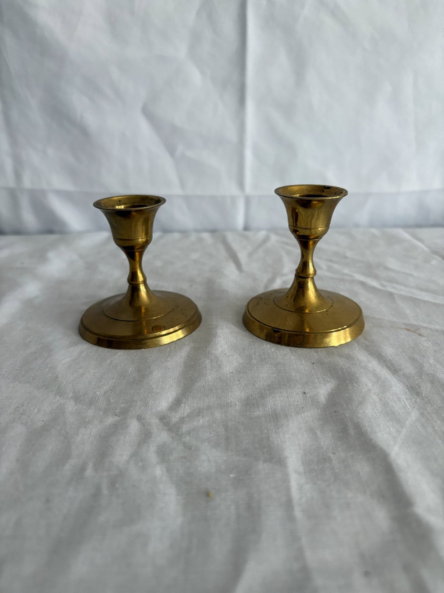 63fe71384f2da238419a4f9e_048092-short-round-brass-candlesticks-1_1767397387265.jpg