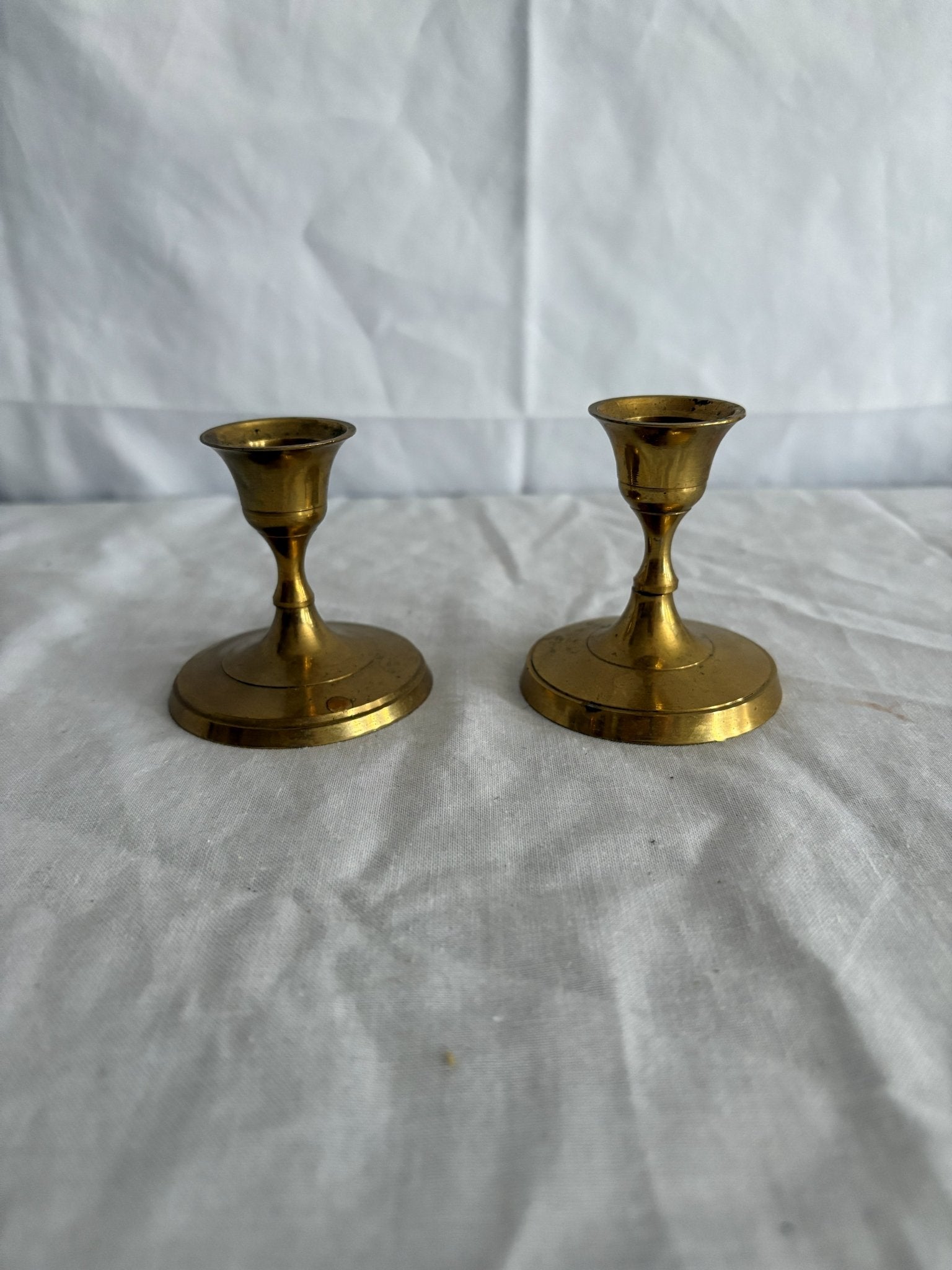 63fe71384f2da238419a4f9e_048092-short-round-brass-candlesticks-1_1767397387265.jpg