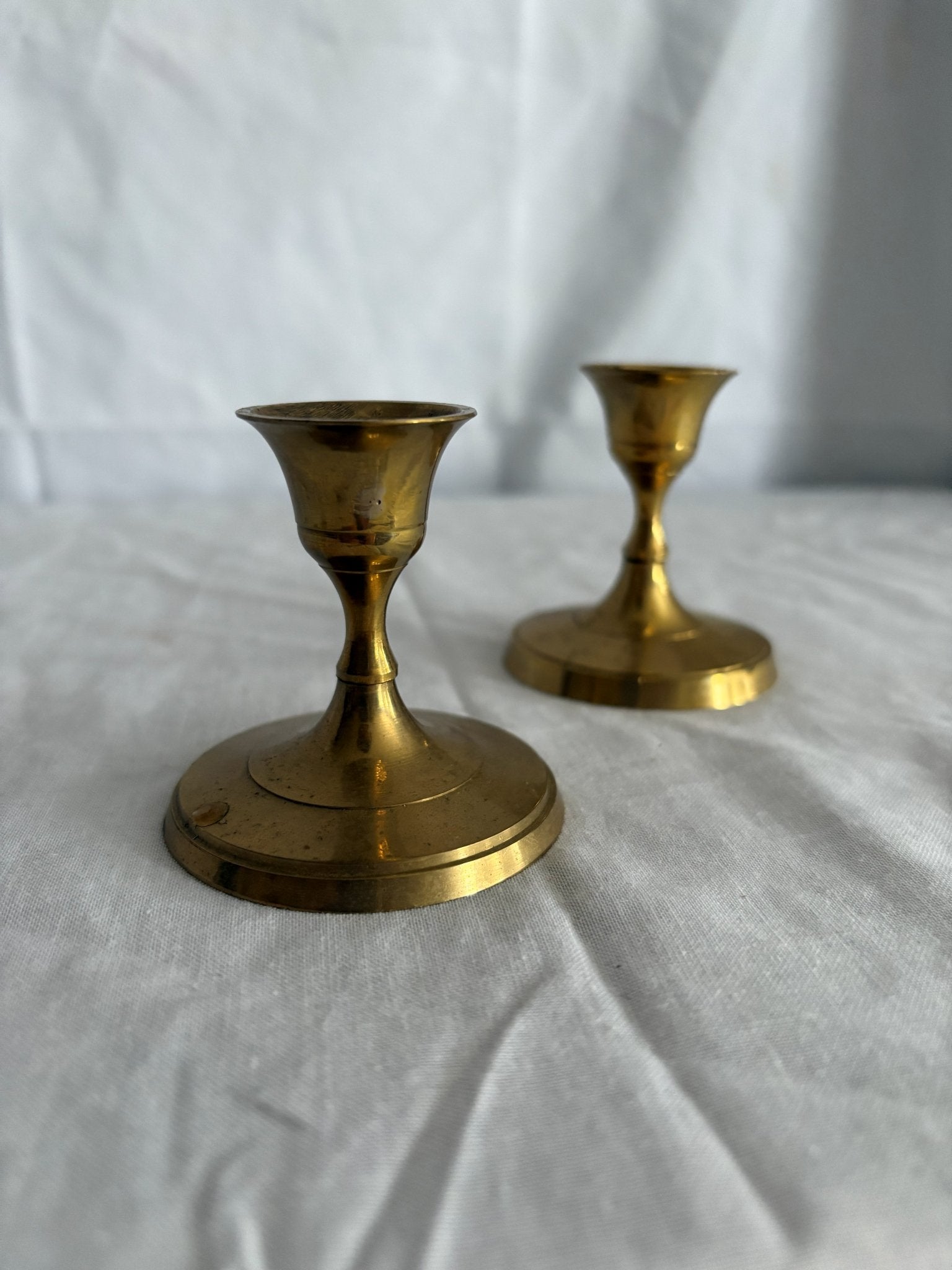 63fe71384f2da238419a4f9e_048092-short-round-brass-candlesticks-5_1767397387267.jpg