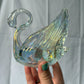 63fe71384f2da238419a4f9e_iridescent-swan-2_1750620935936.jpg