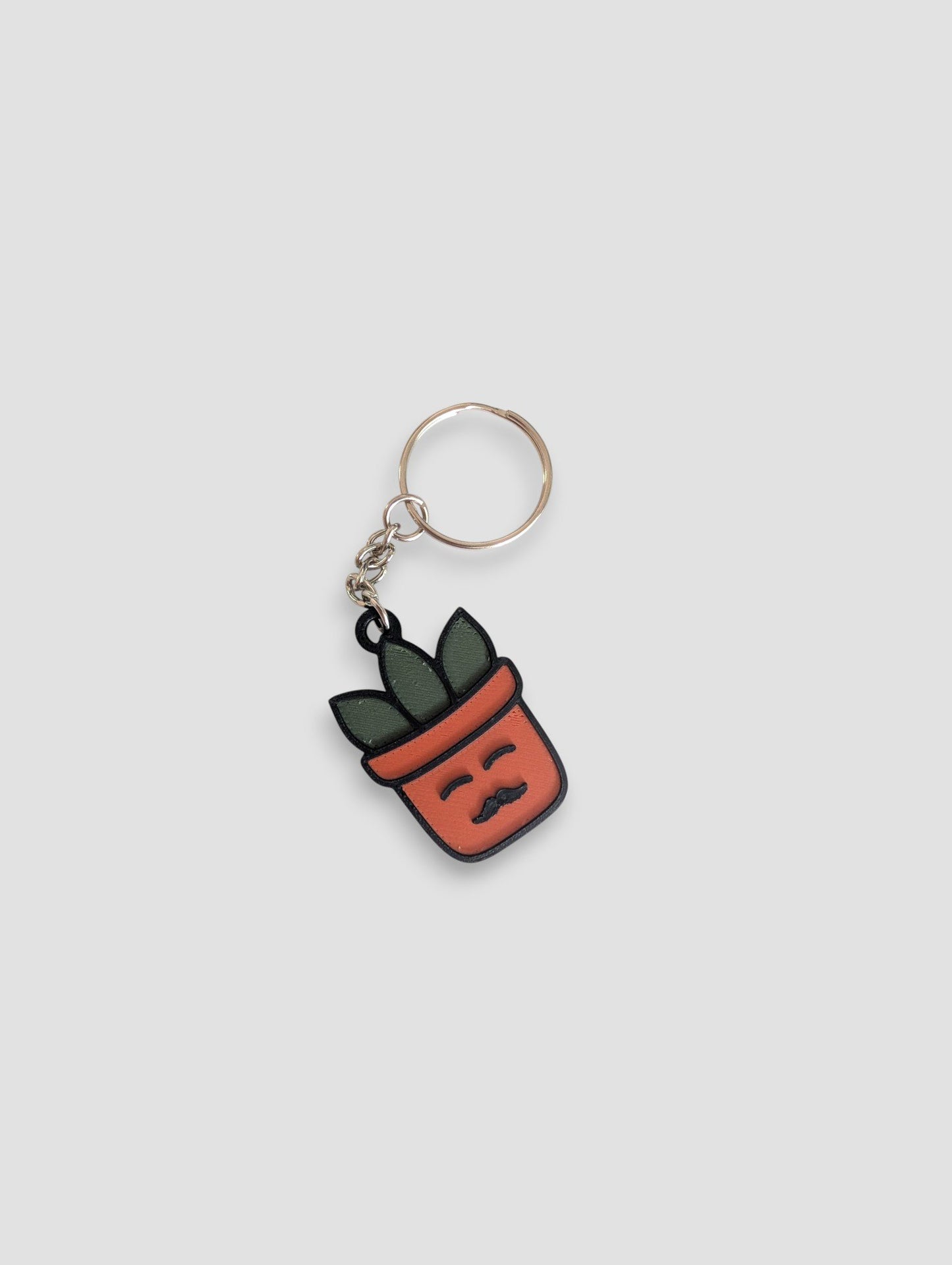 63fe71384f2da238419a4f9e_moustache-plantmoji-keychain_1753360509623.jpg