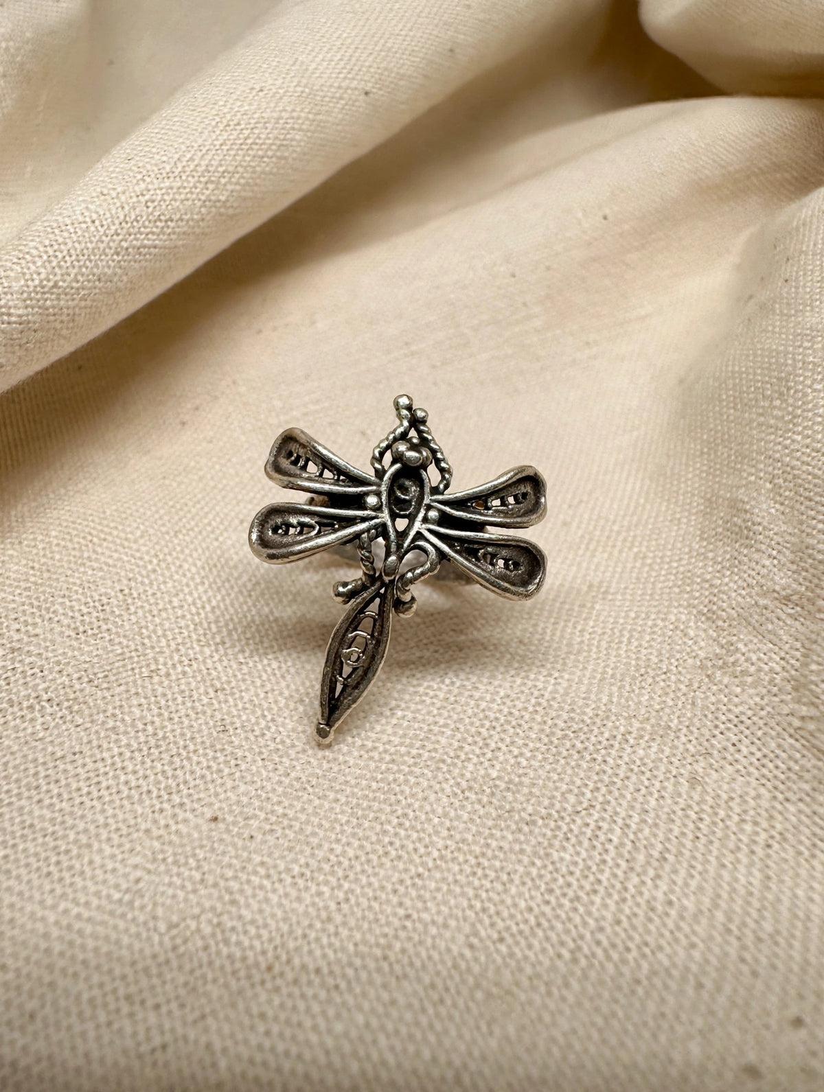 63fe71384f2da238419a4f9e_silver-dragonfly-ring-linen-hq_1788985609502.jpeg