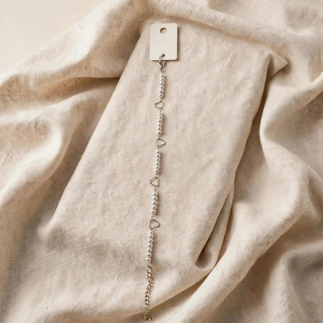 63fe71384f2da238419a4f9e_silver-heart-pearl-bracelet-1080_1789071750245.jpeg