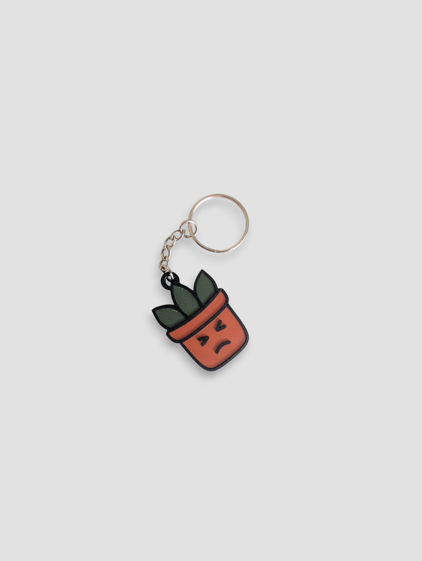 63fe71384f2da238419a4f9e_ughh-plantmoji-keychain_1753360509624.jpg