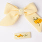 63fe71384f2da238419a4f9e_yellow-hair-bow-and-clip-set_1788461815599.jpg